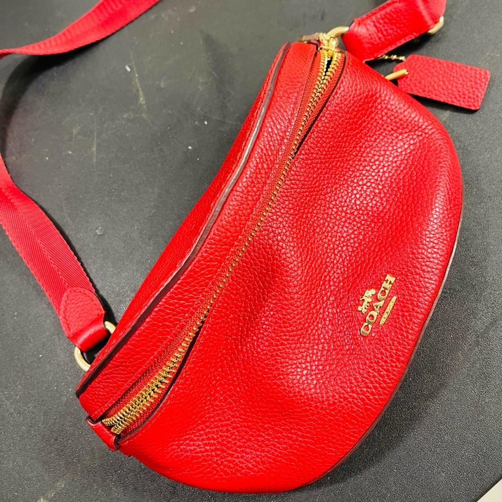 Polished pebble leather,zip closure , outside pocket.